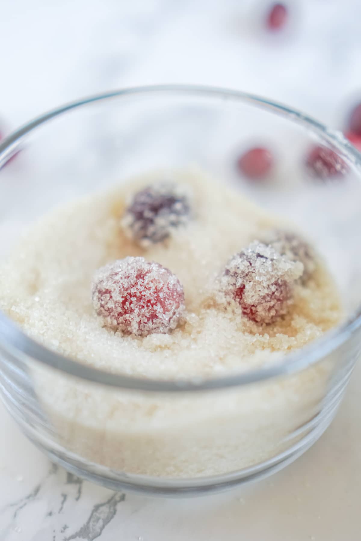 Glass bowl with sugared cranberries