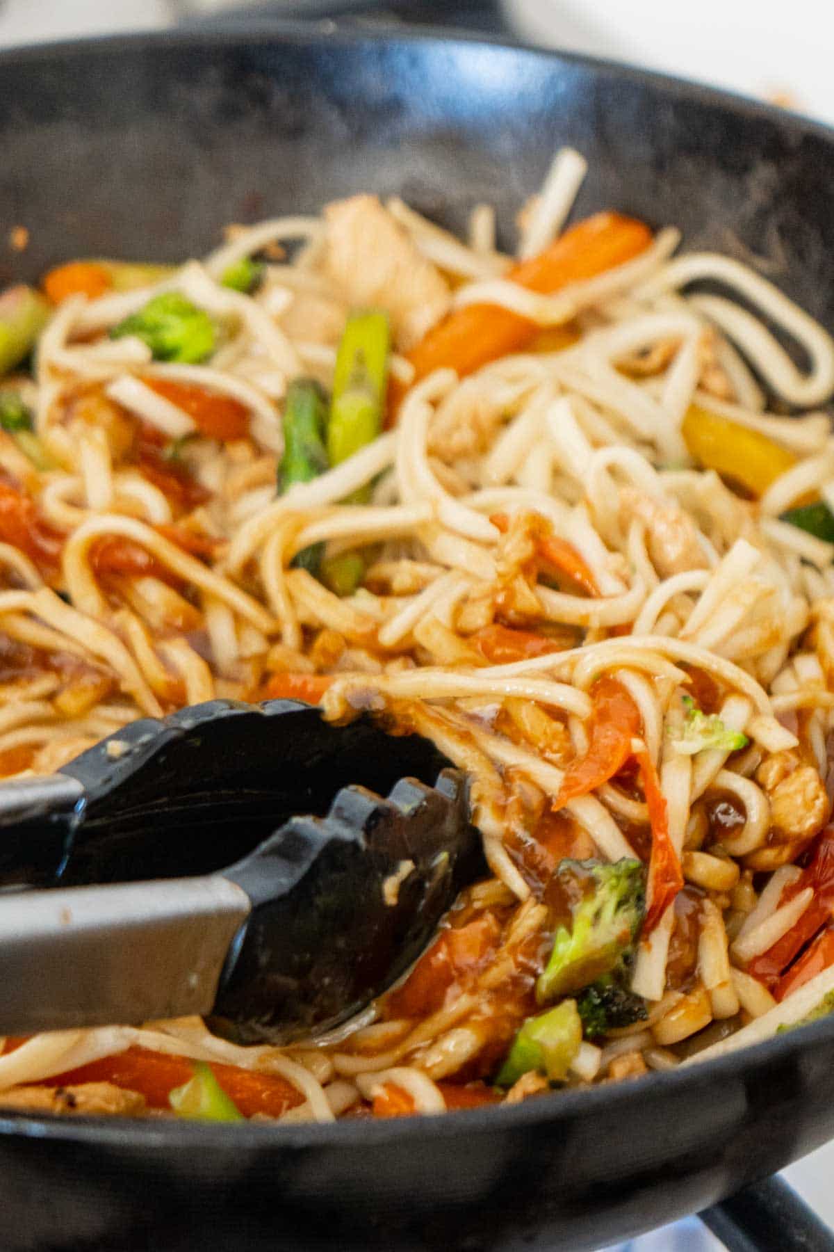 Teriyaki chicken stir fry in a wok