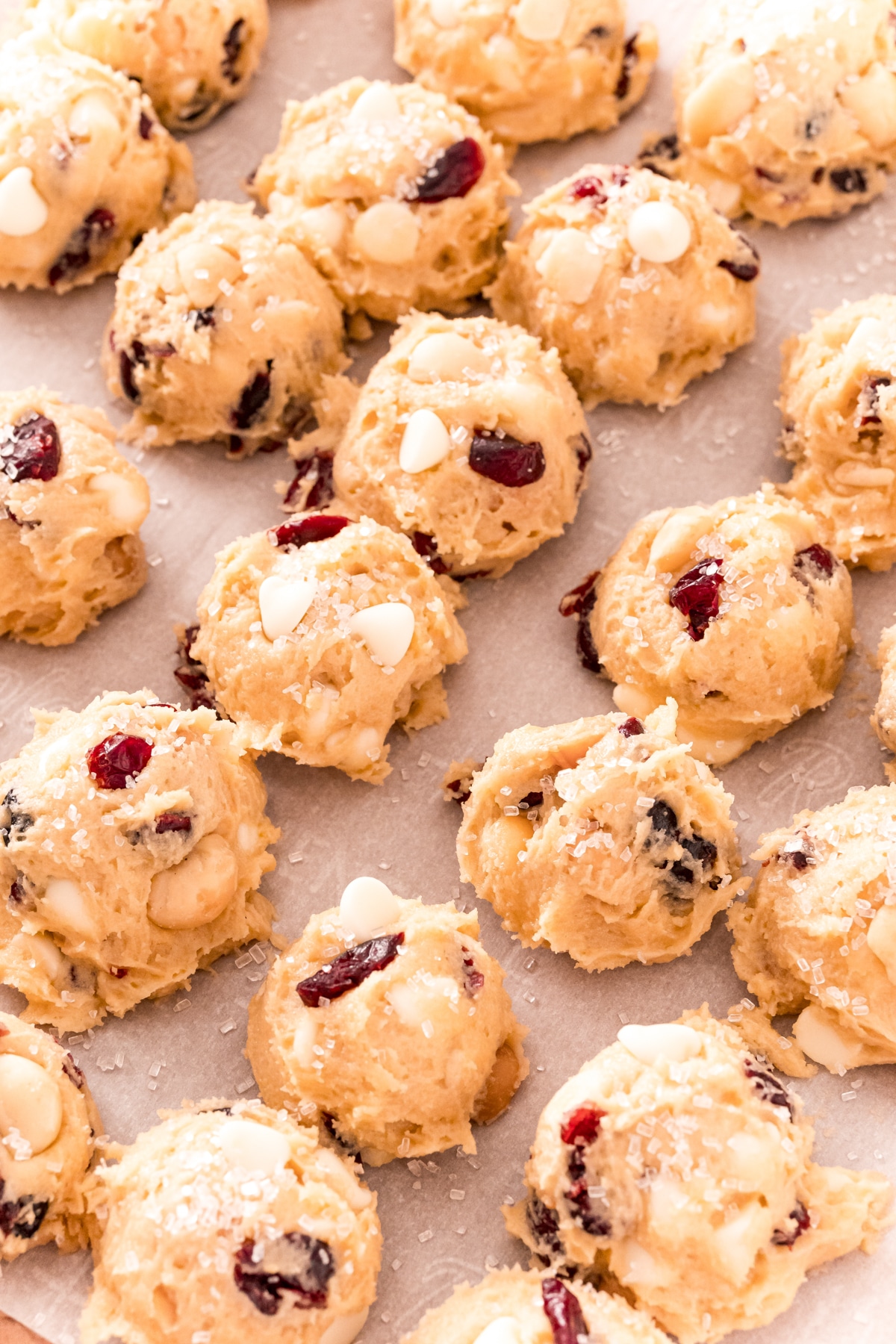 White chocolate cranberry cookies on a baking sheet