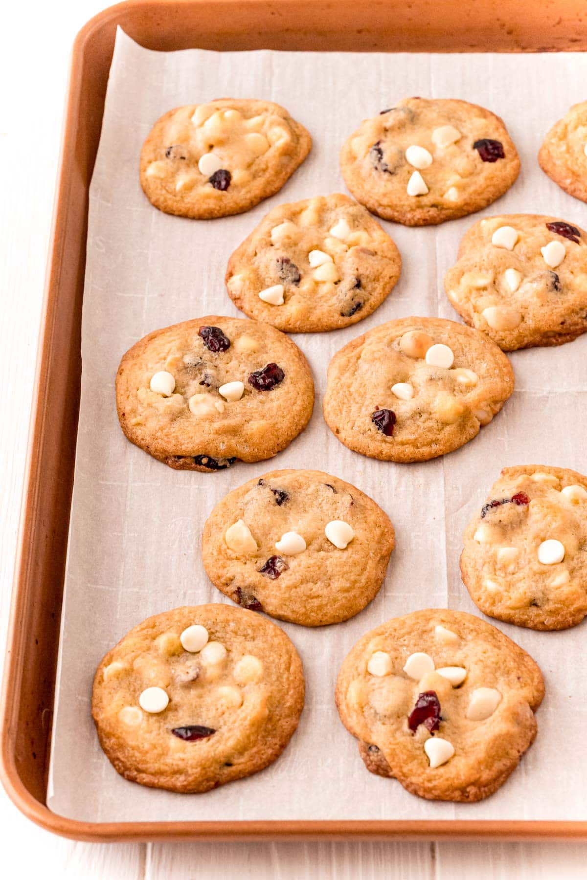 White chocolate cranberry cookies baked on a baking sheet