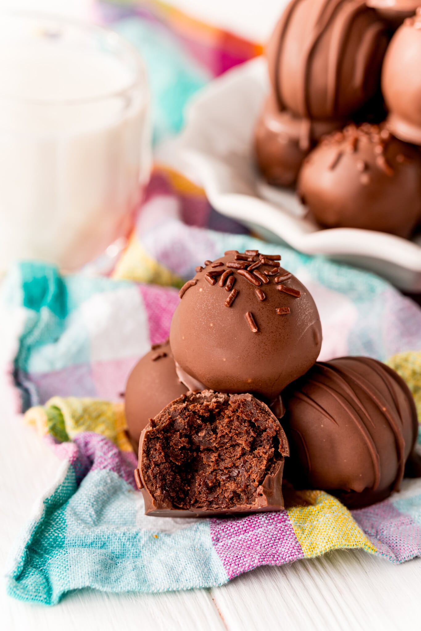 Stack of brownie balls including one with a bite out of it