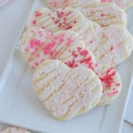 White plate with cream cheese sugar cookies