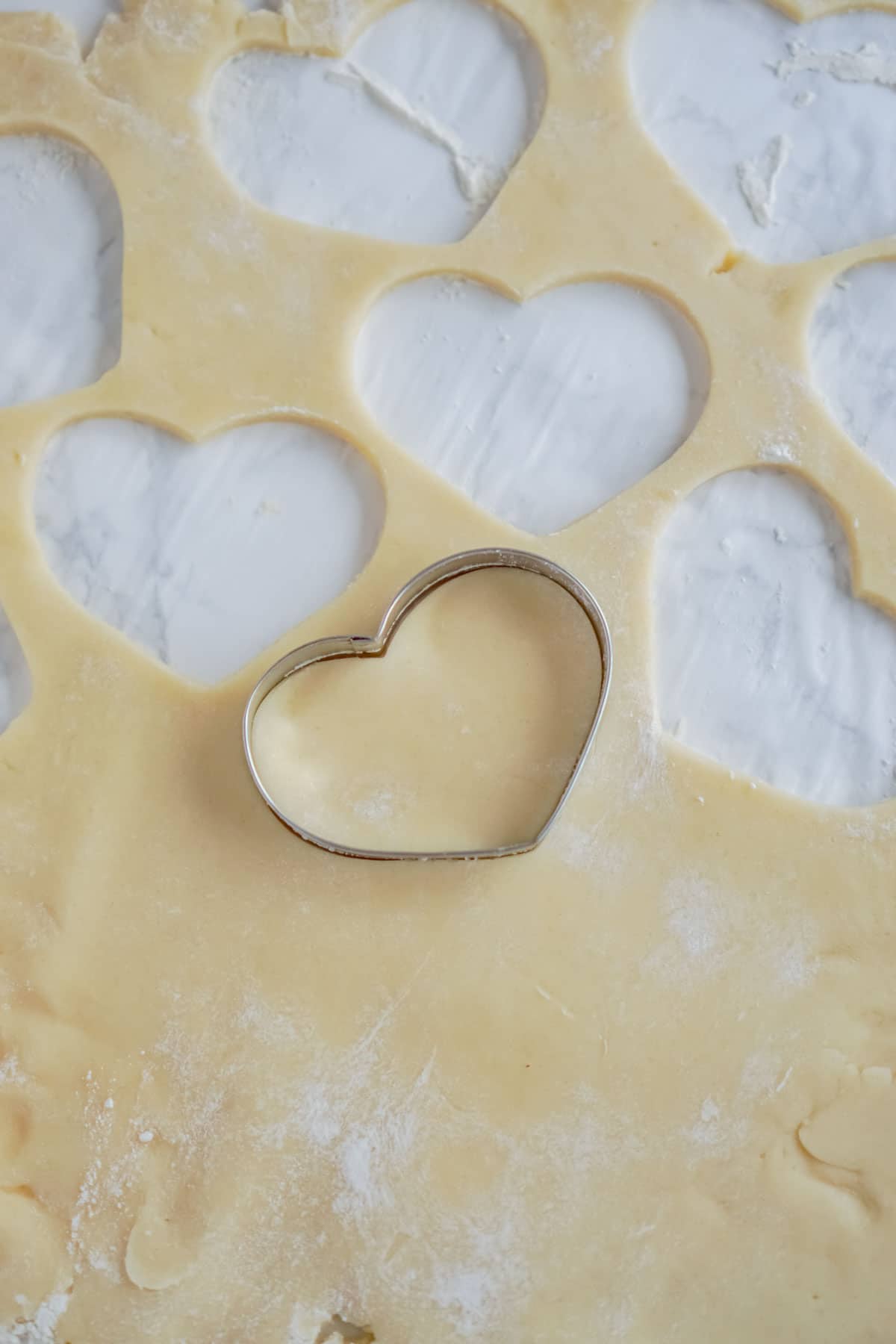 Heart shaped cookie cutter with cookie dough