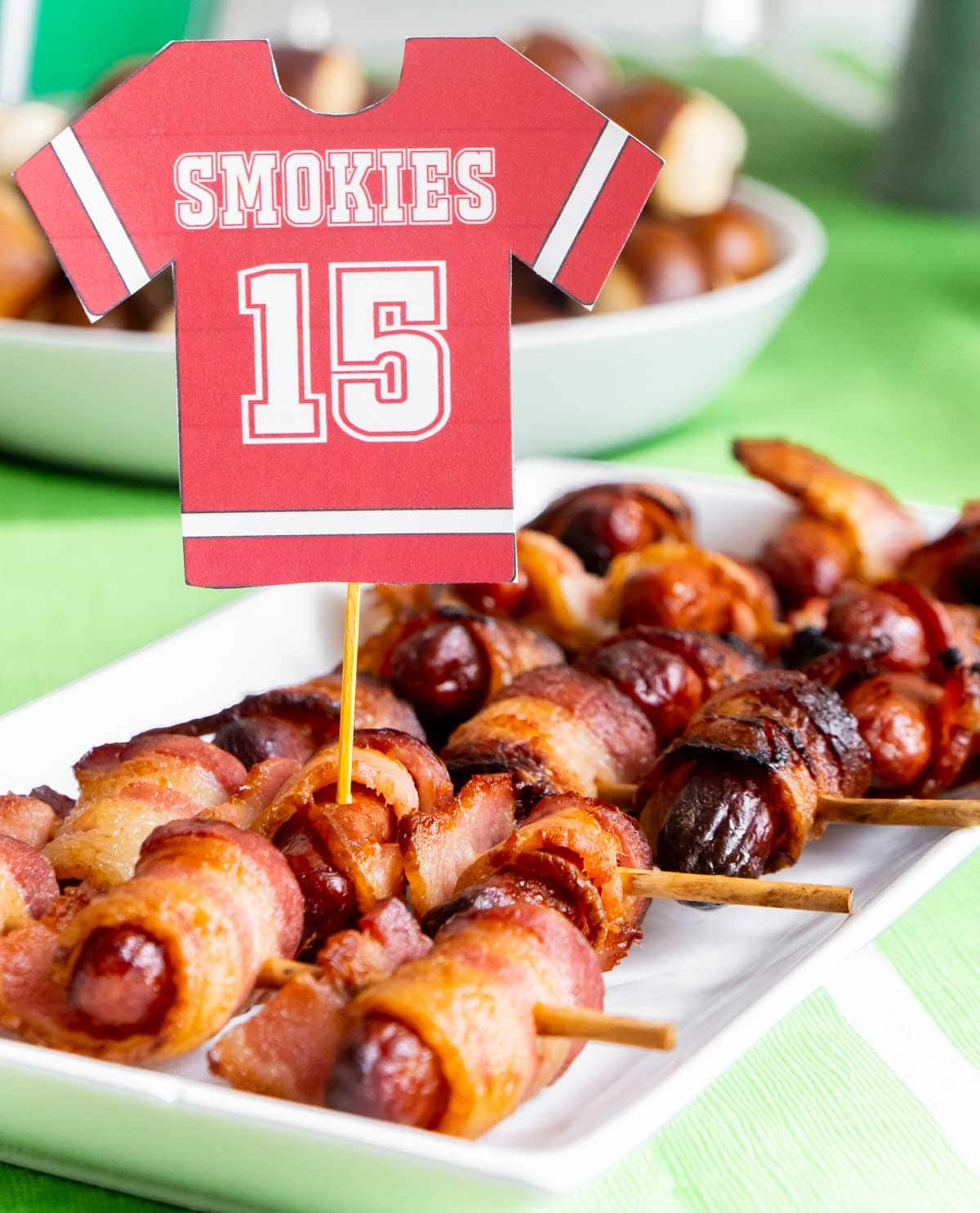 Bacon wrapped smokies on a plate