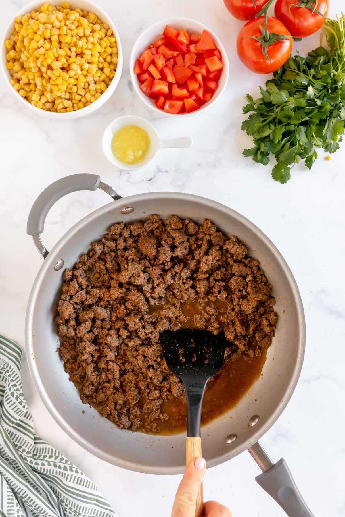 Taco meat in a pan with a spatula