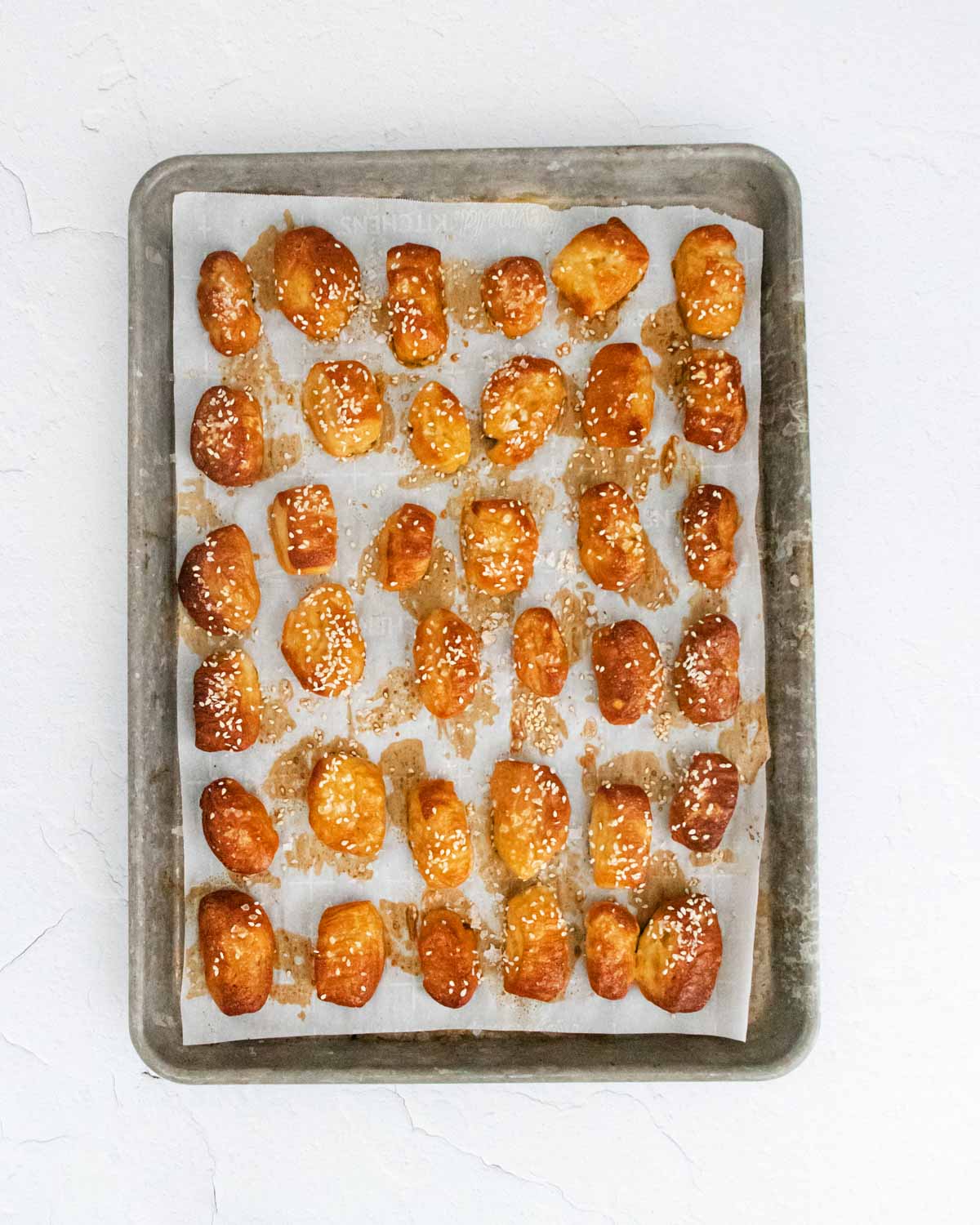 Baking tray full of cooked pretzel bites