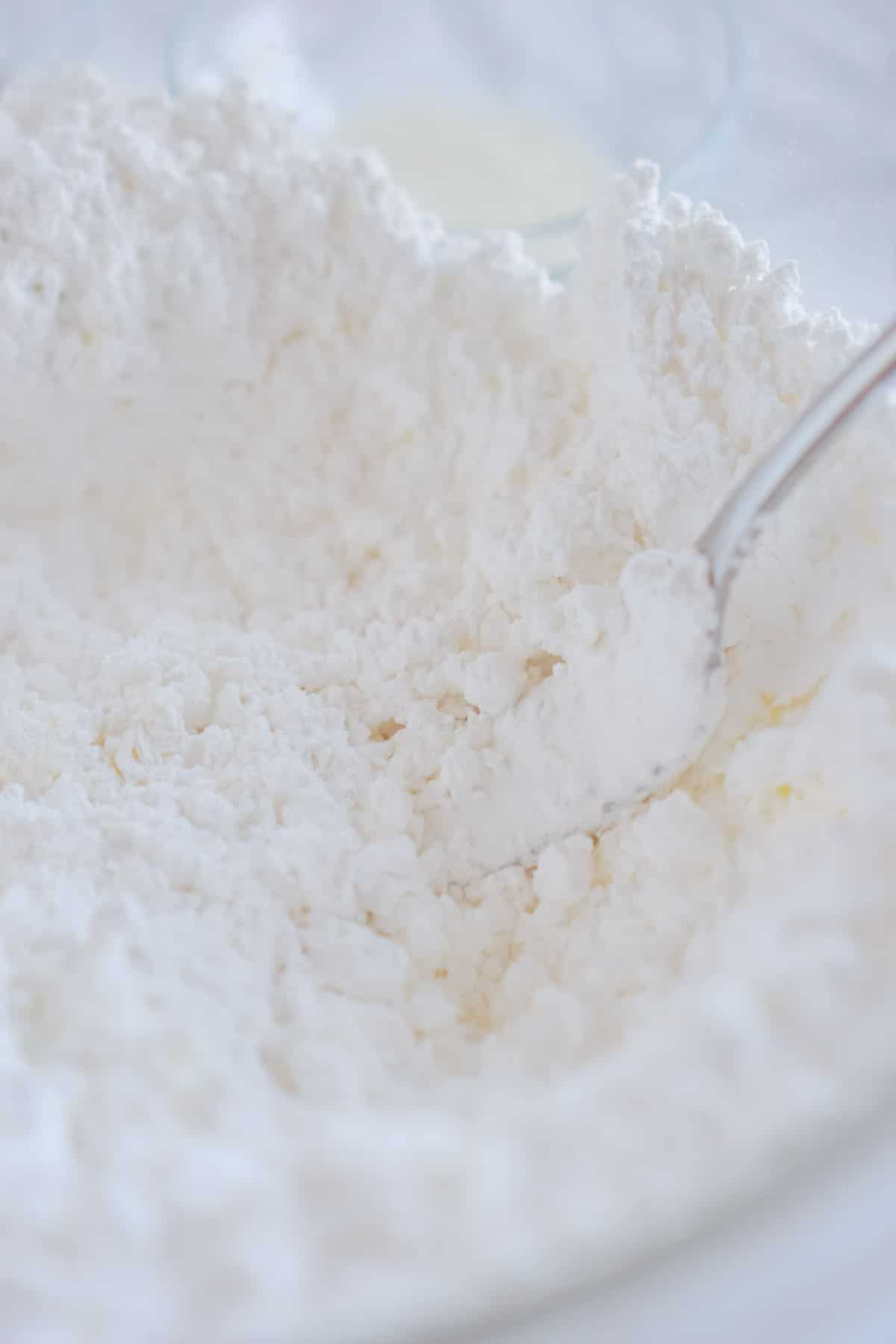 dry ingredients for sugar cookie icing in a mixing bowl