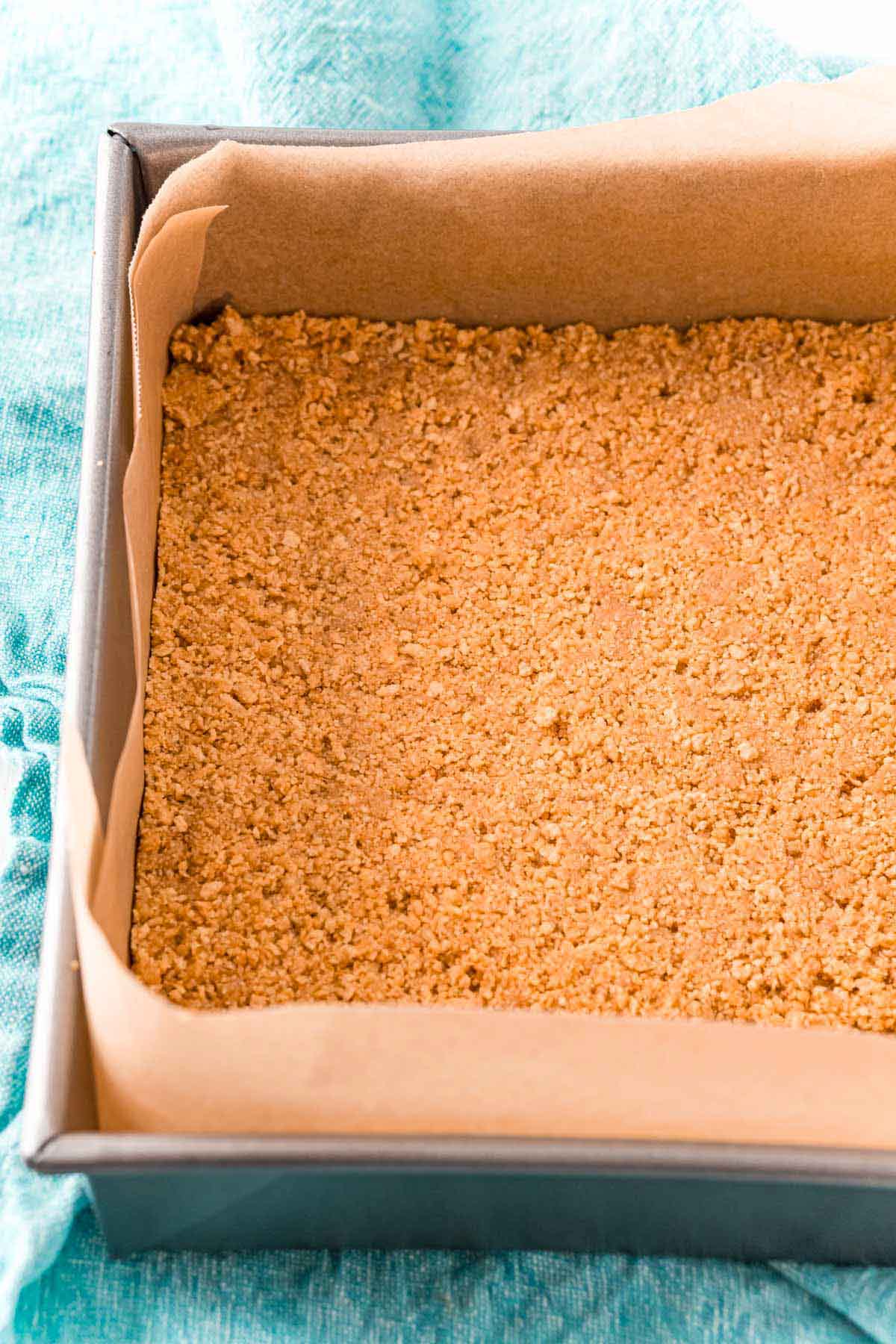 Graham cracker crust in a baking pan