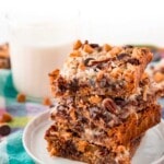 7 layer bars stacked on a white plate