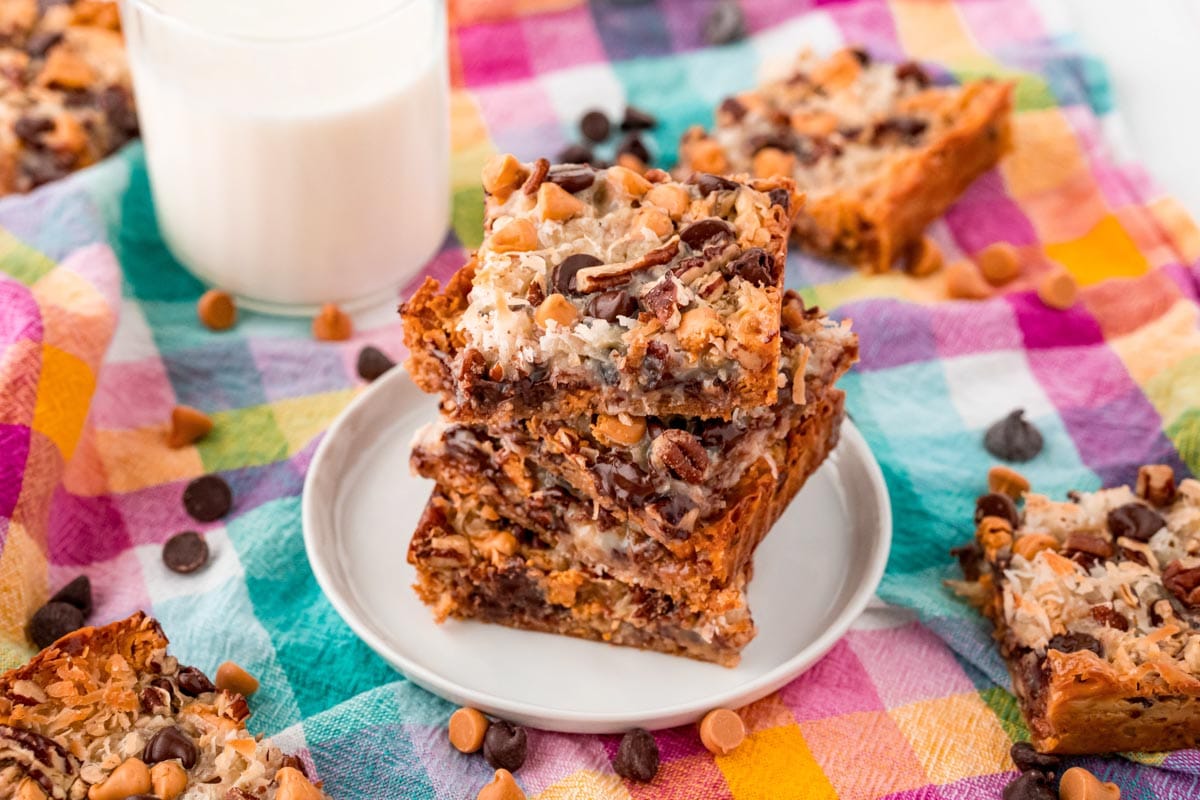 Horizontal photo of 7 layer bars stacked on a plate