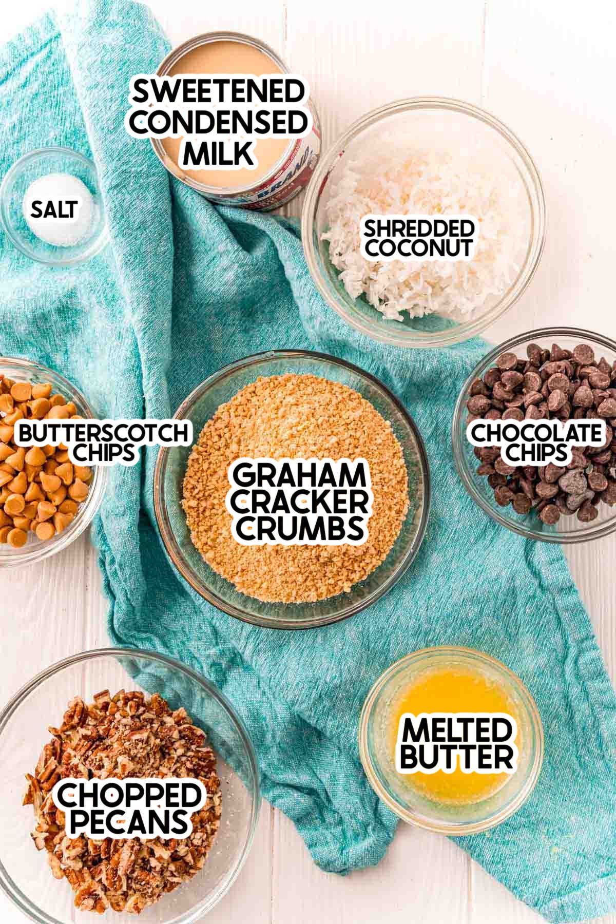 Ingredients needed to make seven layer bars with labels