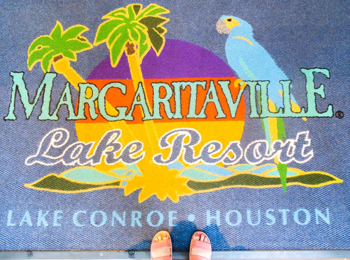 Feet on a Margaritaville Lake Conroe floor mat