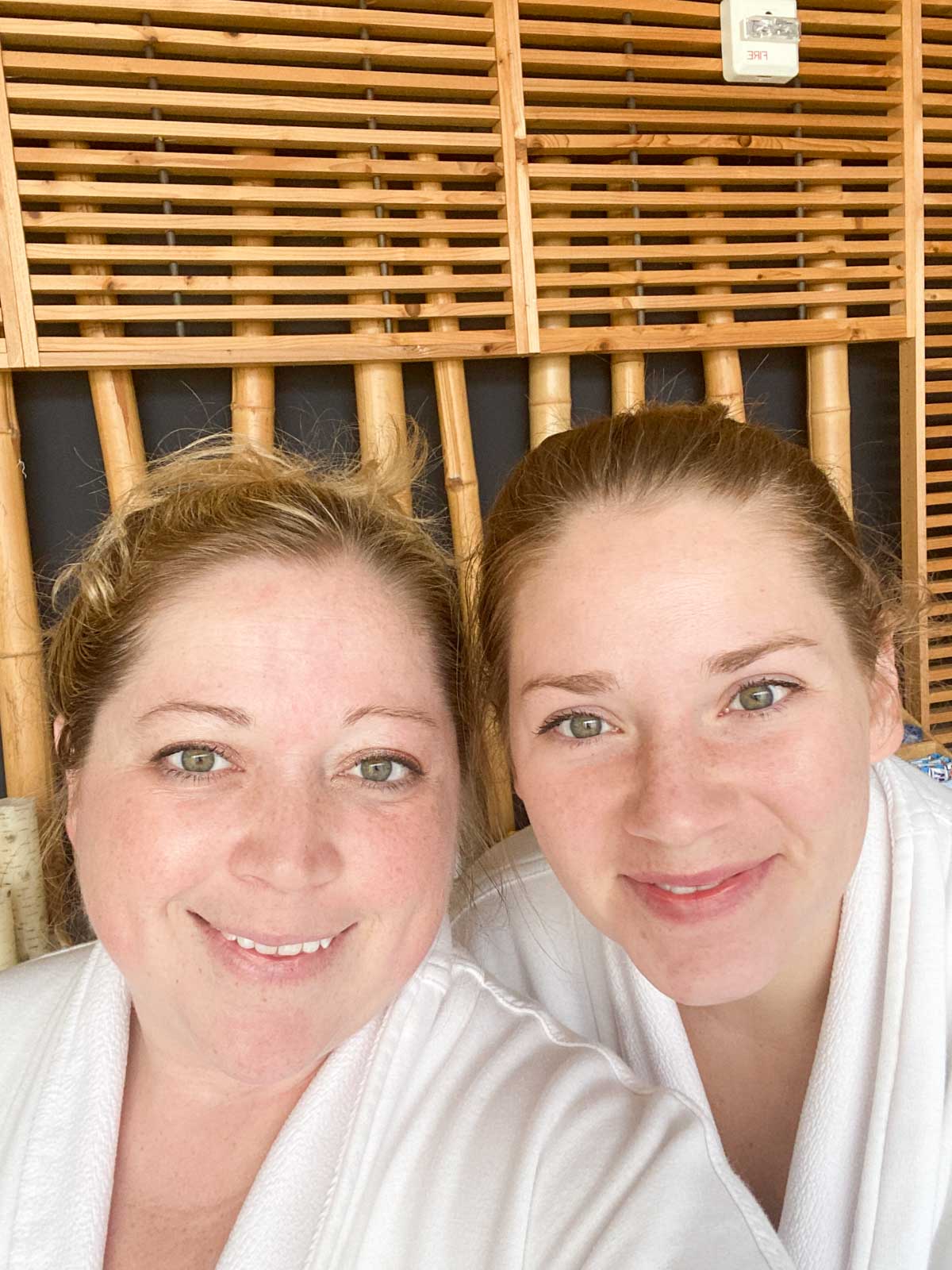 Selfie of two women in robes at a spa