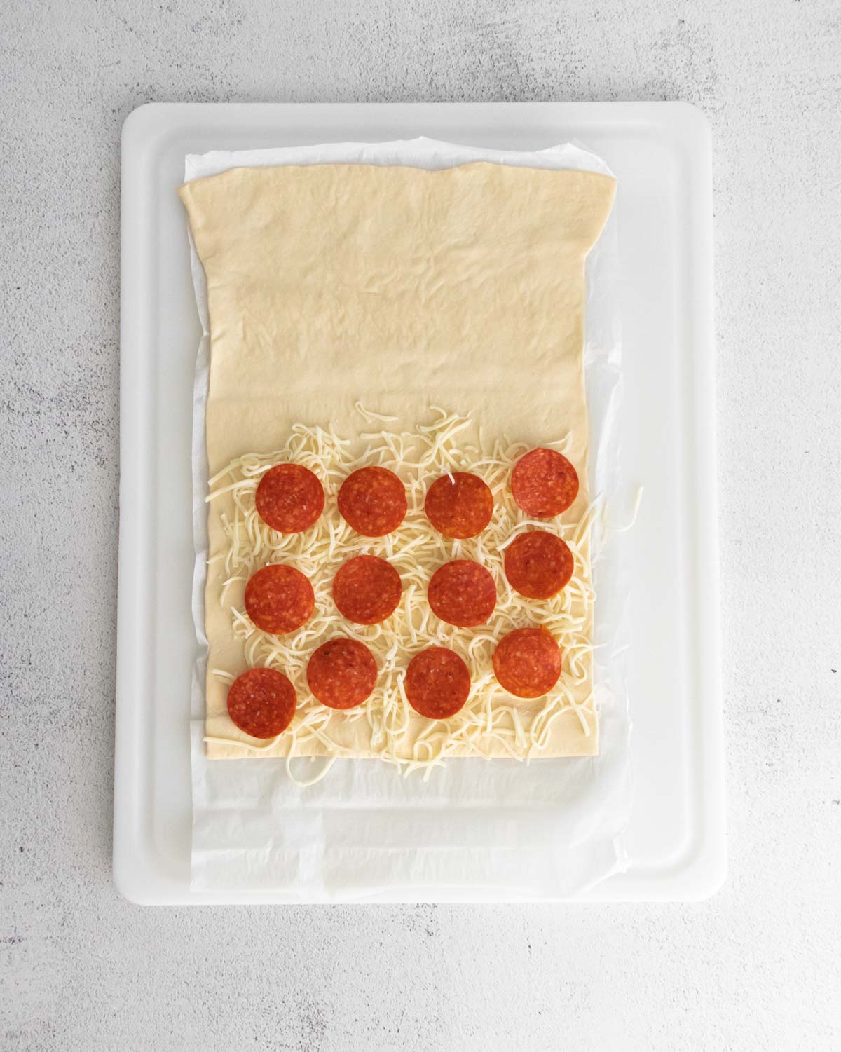 Pizza dough topped with toppings