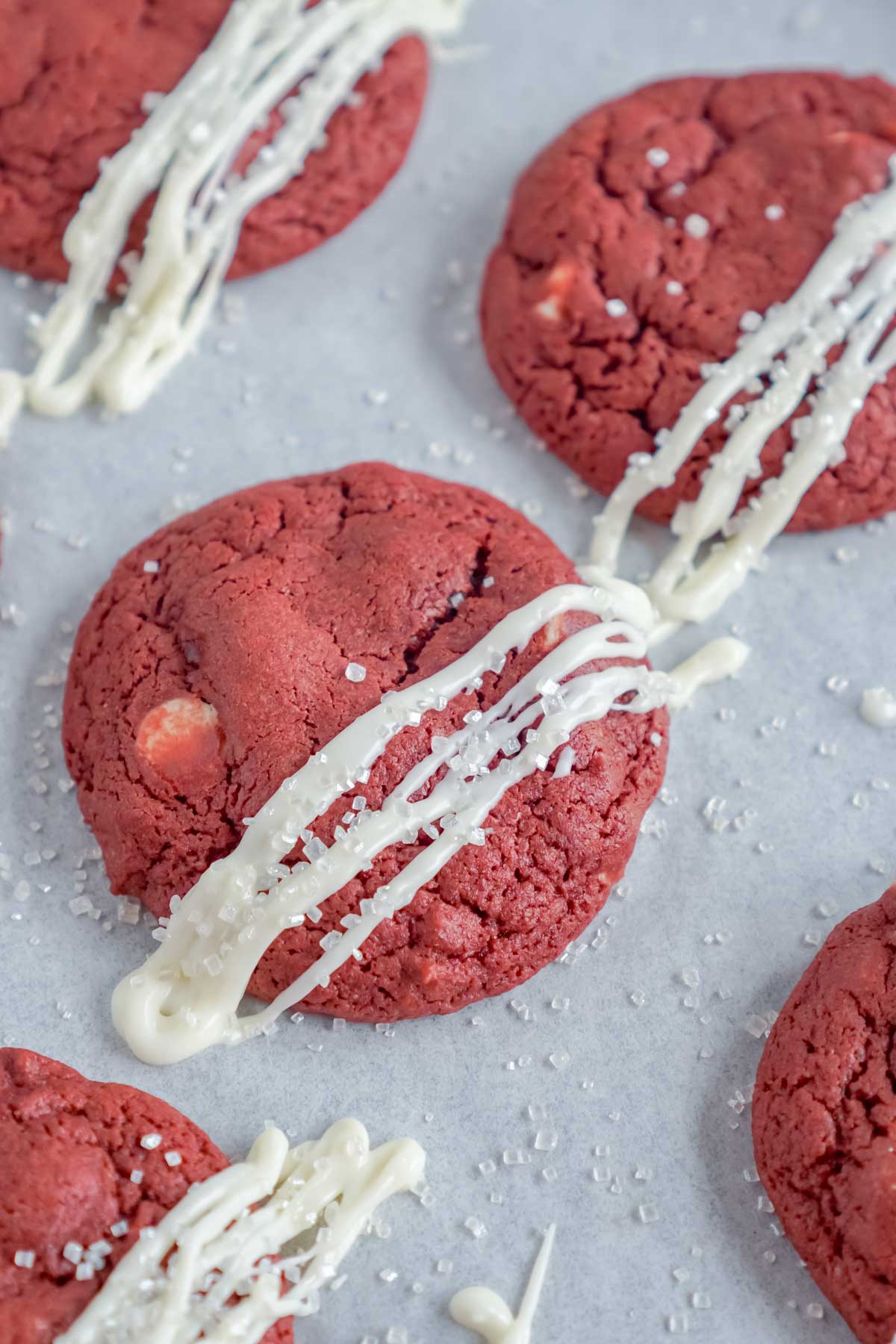 Baking sheet with frosted red velvet cookies