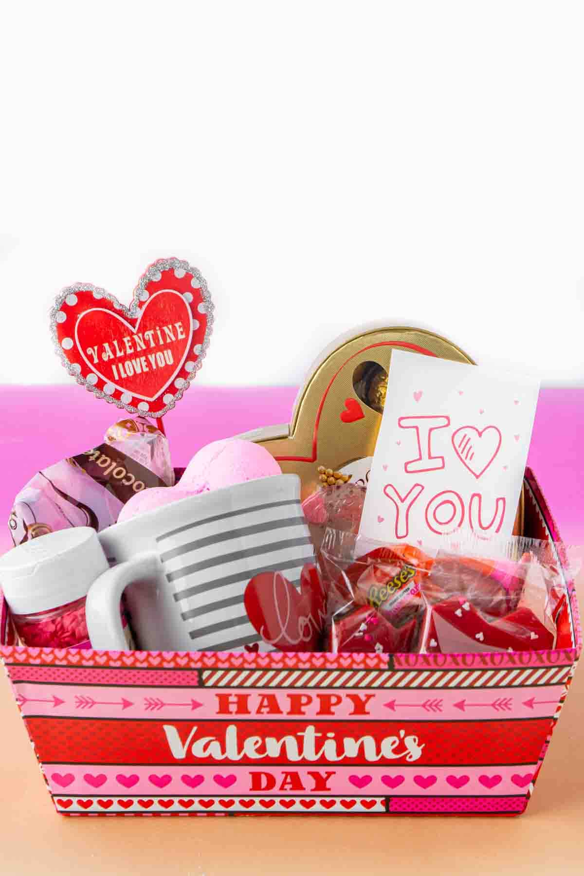 Valentines Day basket with candy and gifts inside