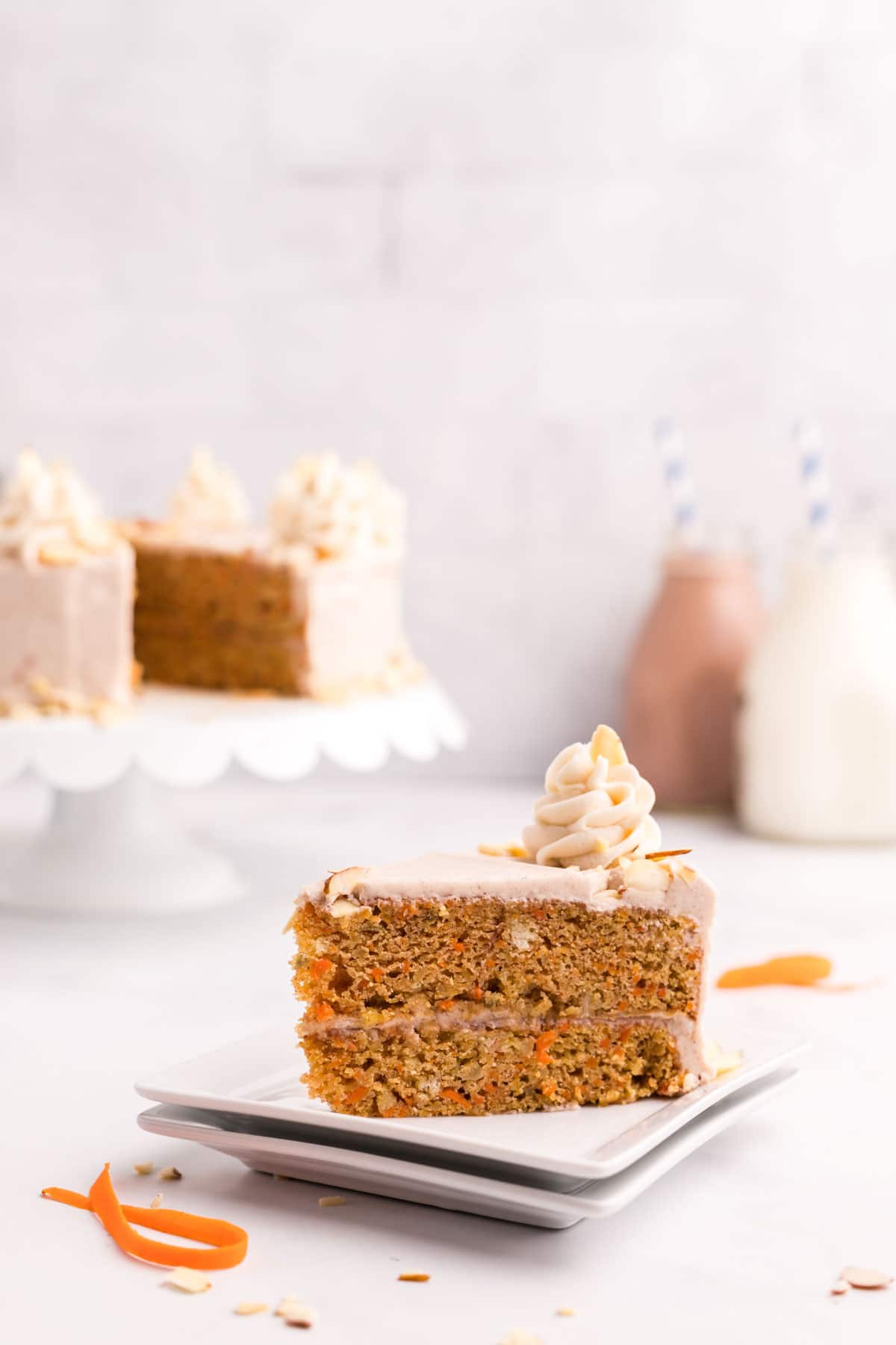 slice of carrot cake on a white plate