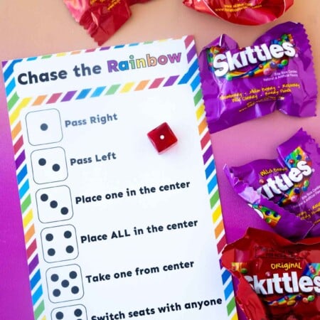 dice skittles game card and bags of skittles