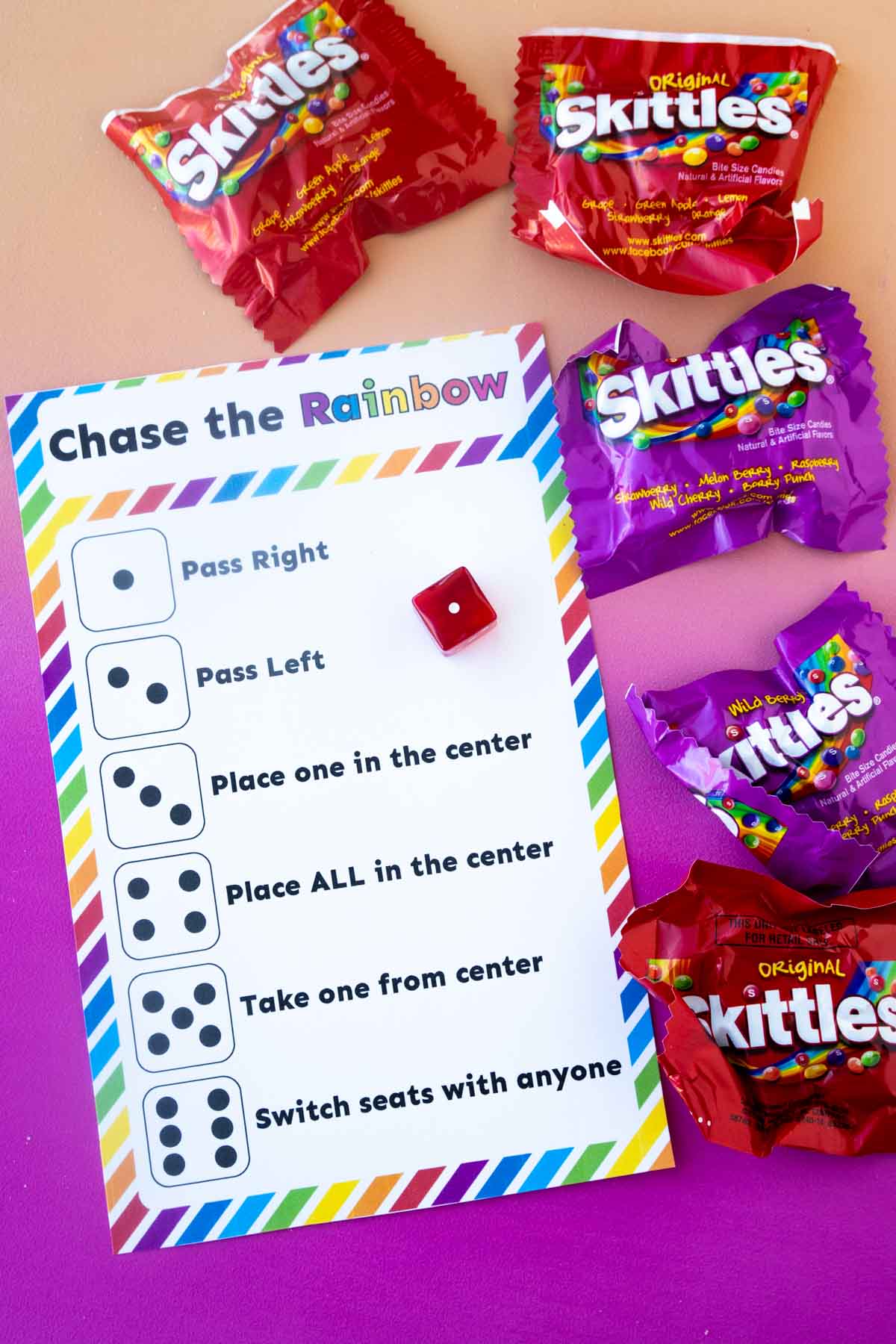 dice skittles game card and bags of skittles