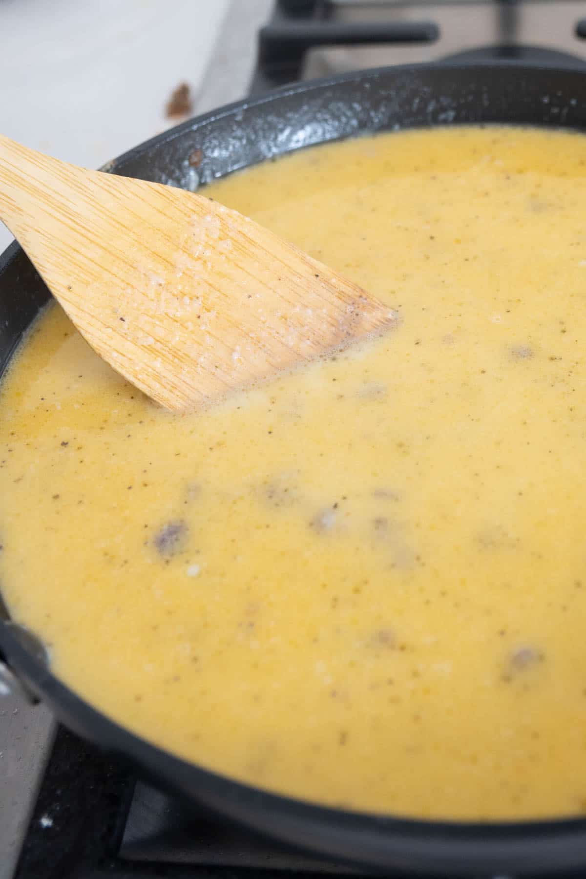 unthickened sausage gravy in a pan