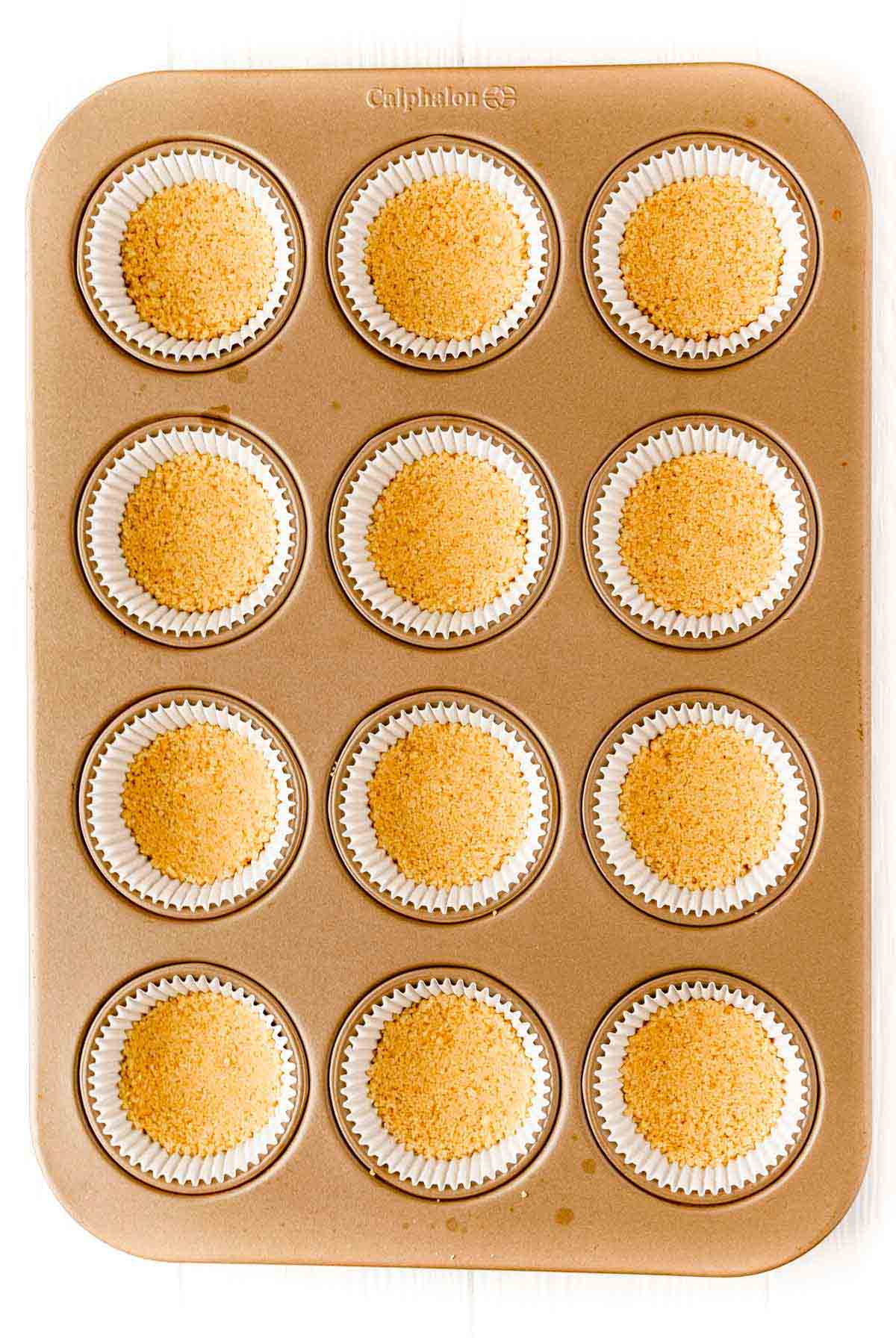 shortbread crust for mini egg cheesecakes in a muffin tin