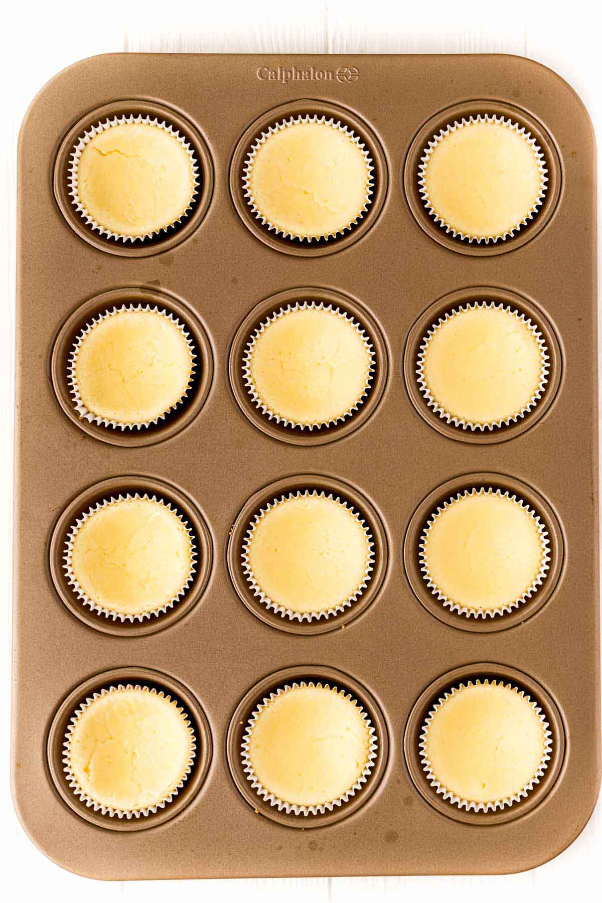 Mini egg cheesecakes after baking in a muffin tin