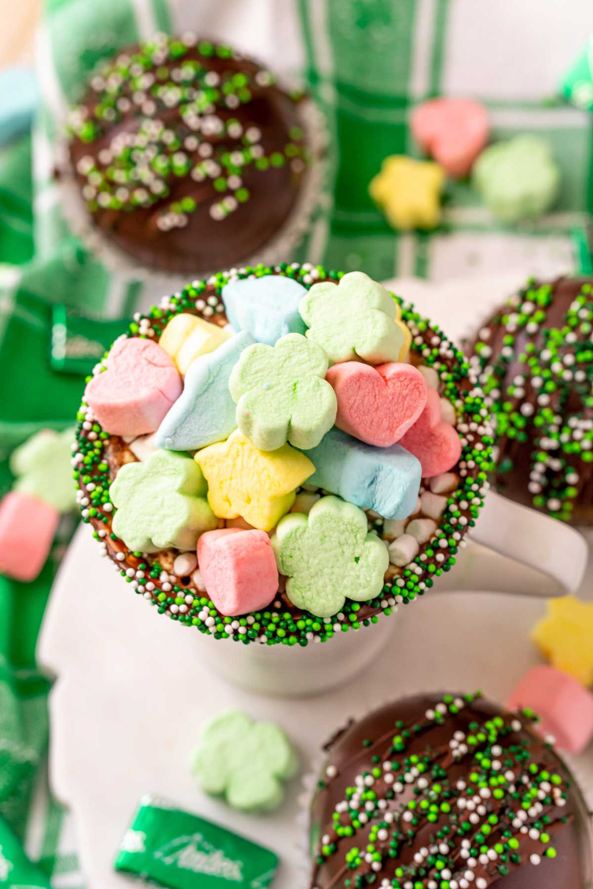 Mug filled with hot chocolate and Lucky Charms marshmallows