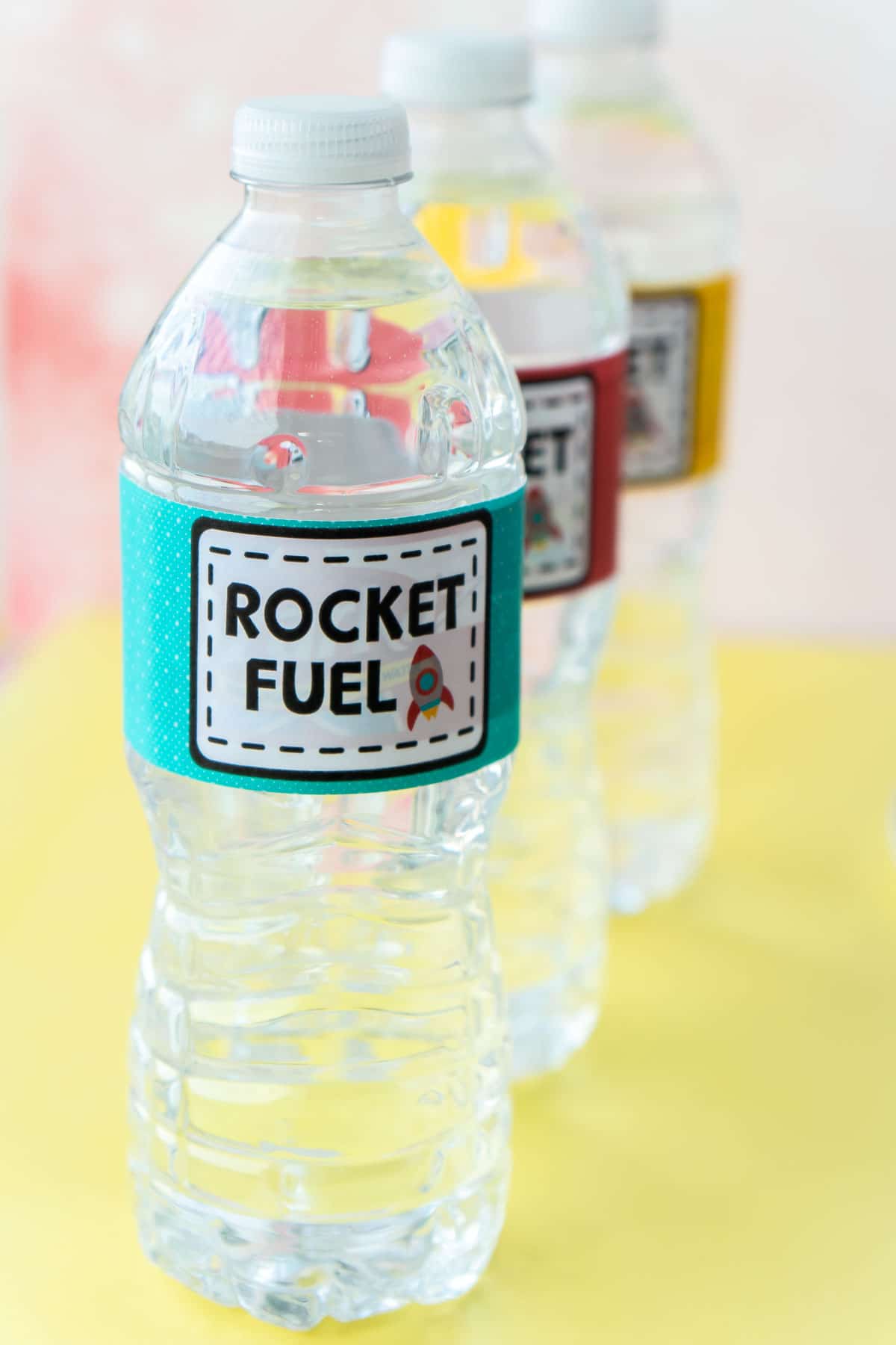 water bottles with space party labels