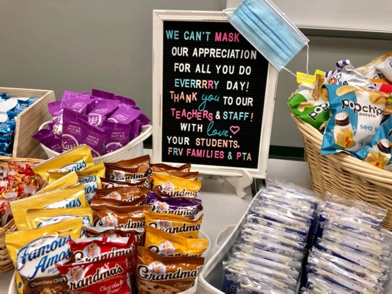 Snacks on a table with a sign