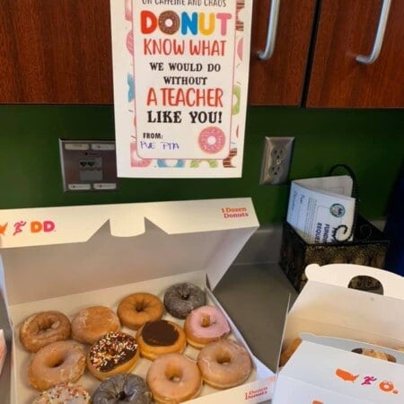 Donuts with a sign hanging above them