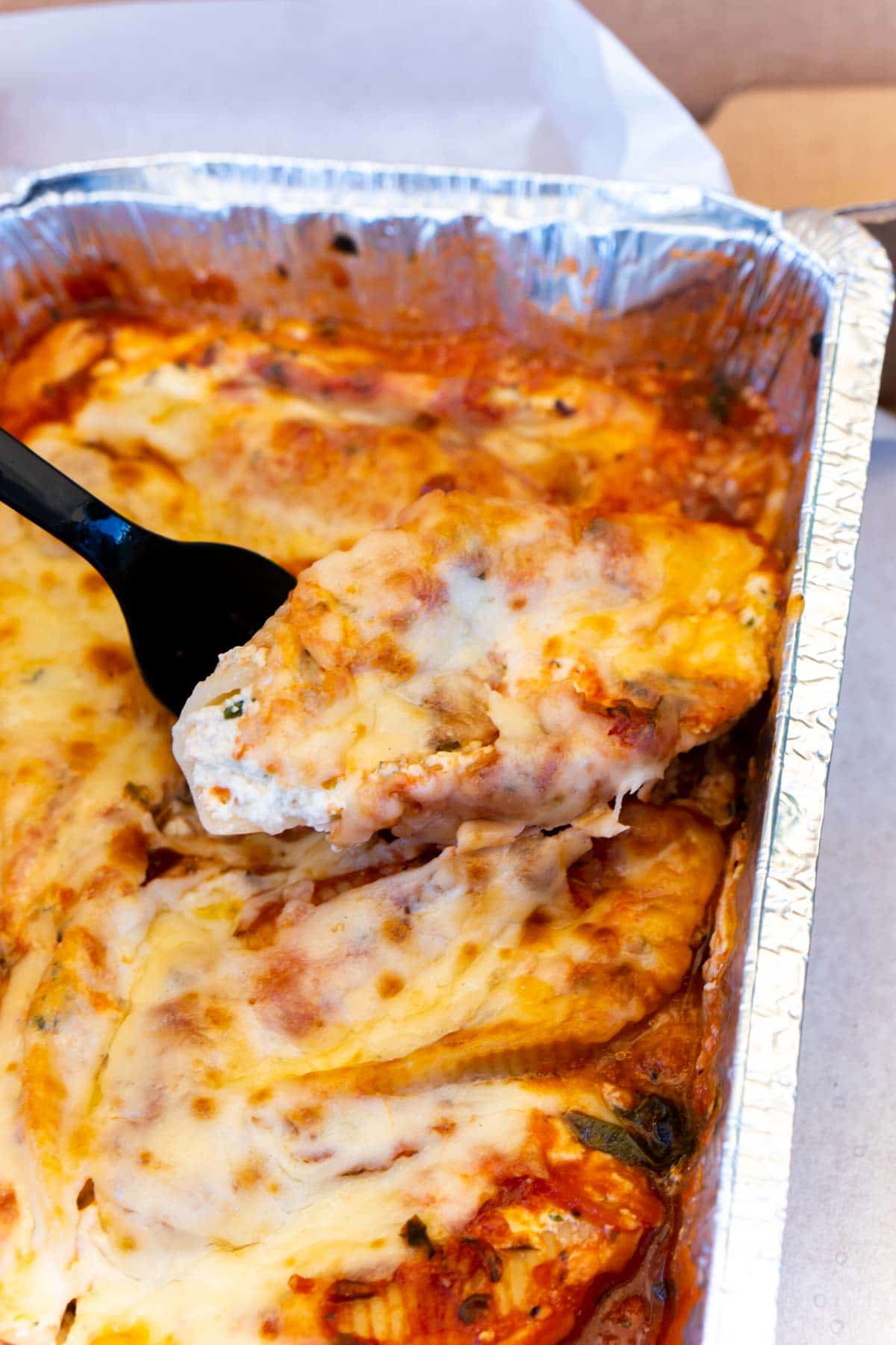 Stuffed shells in a metal cooking dish