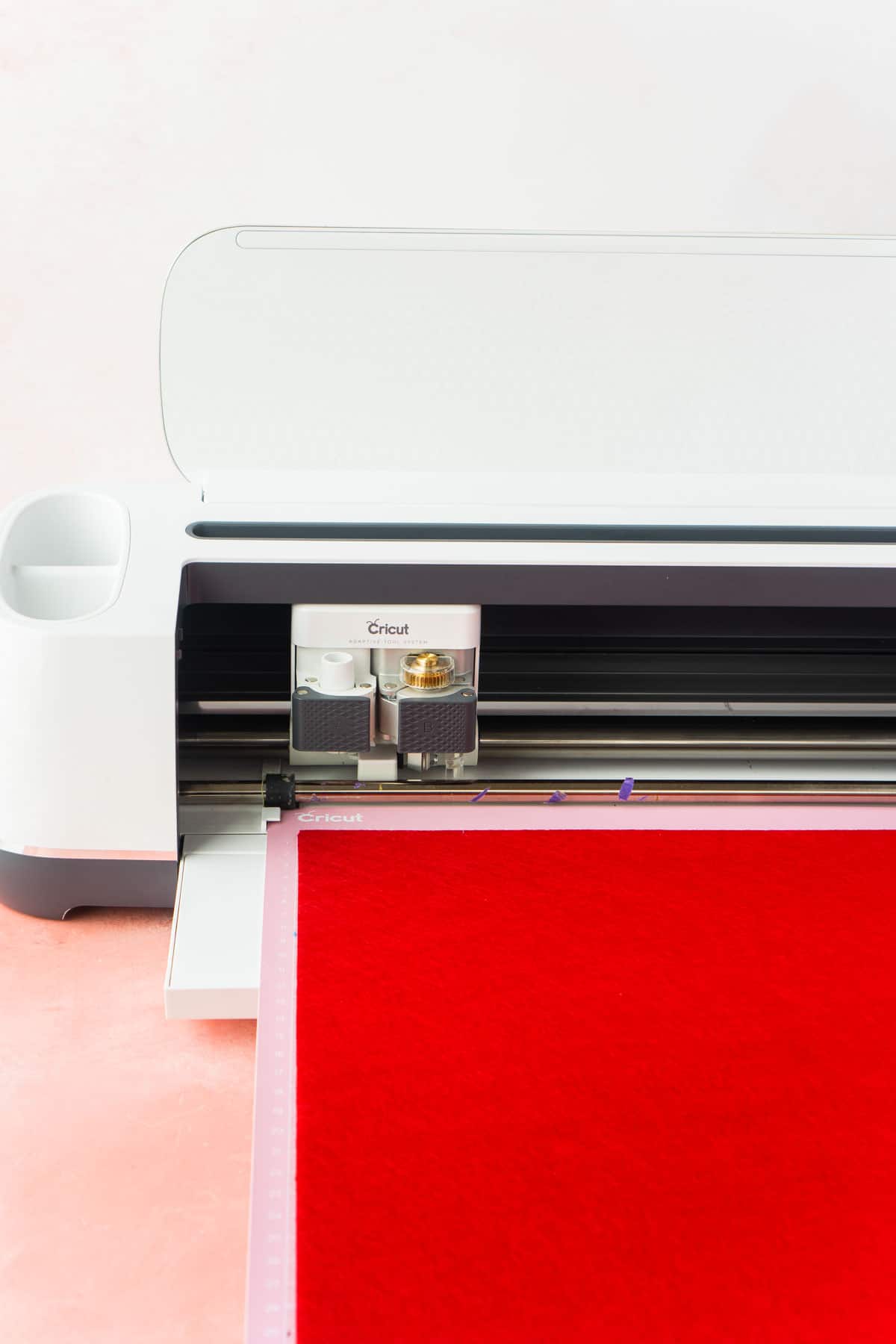 Cricut Maker with a piece of felt loaded onto the mat