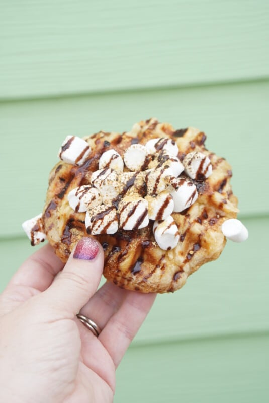 Woman's hand holding a s'mores waffle