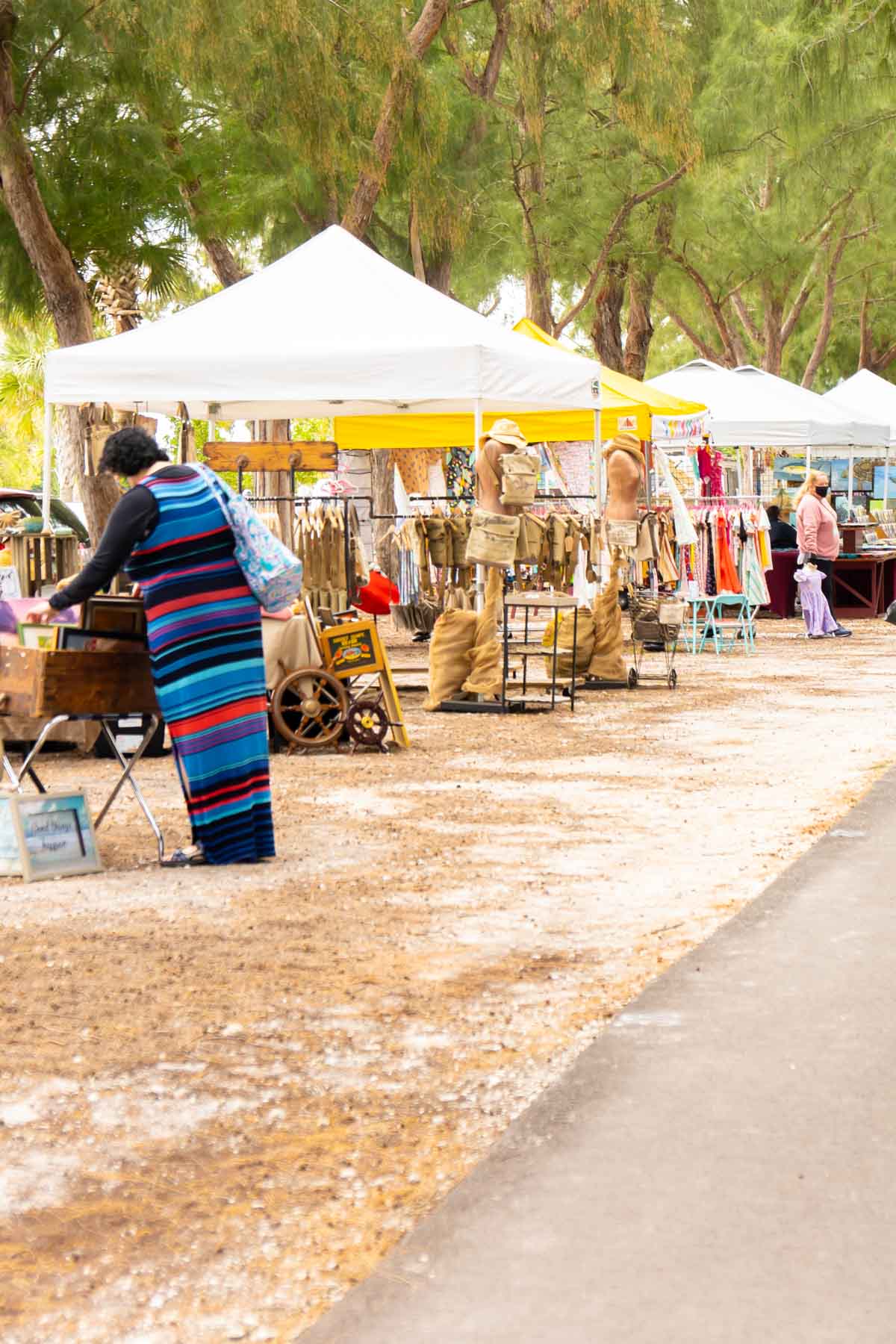 Vendors setup in tents at a beach market