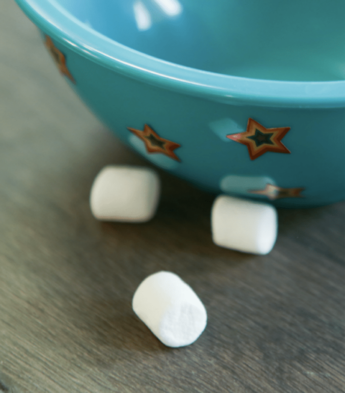 bowl with star stickers and marshmallows next to it