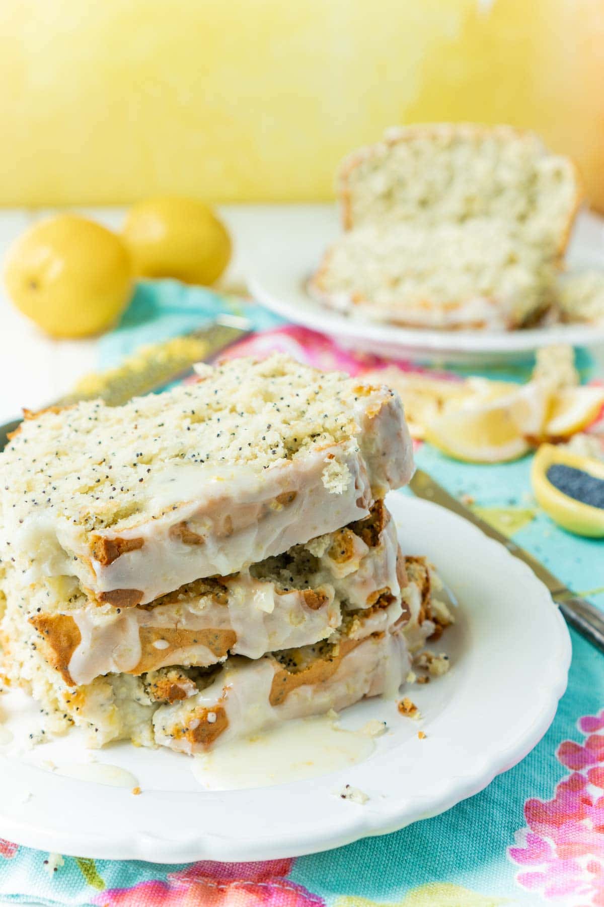 Sliced pieces of lemon poppy seed bread on a white plate