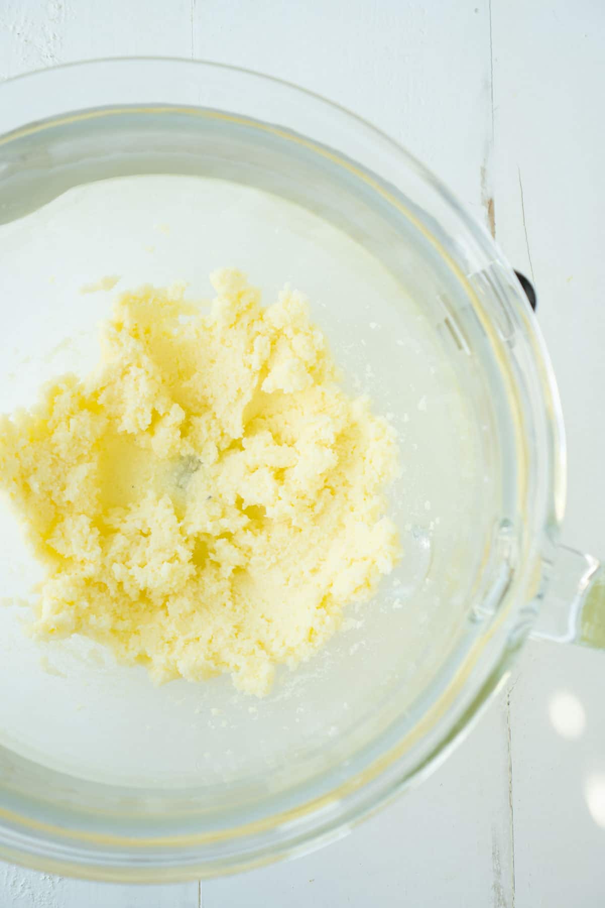 creamed butter and sugar in a glass bowl