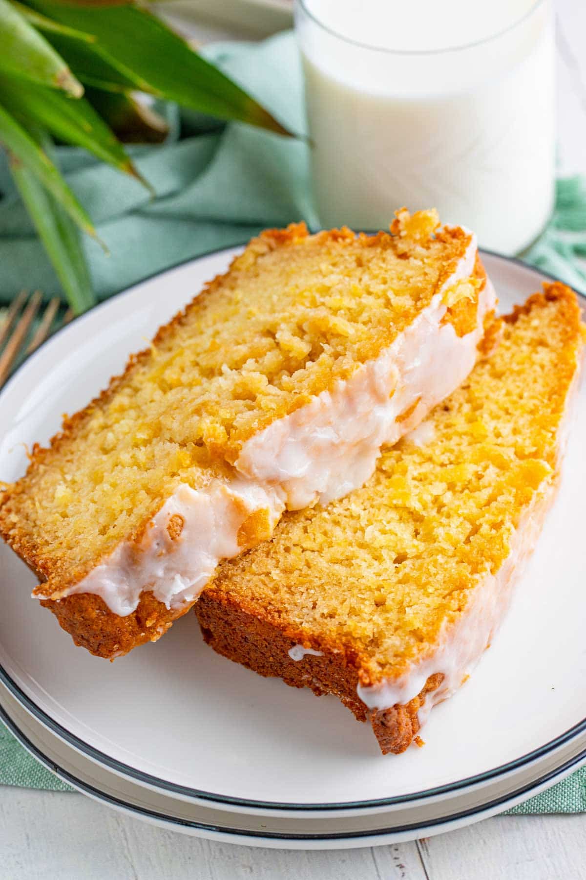 two slices of pineapple bread on a white plate