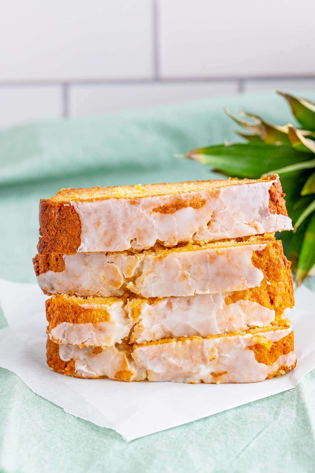 slices of pineapple bread stacked on a white plate