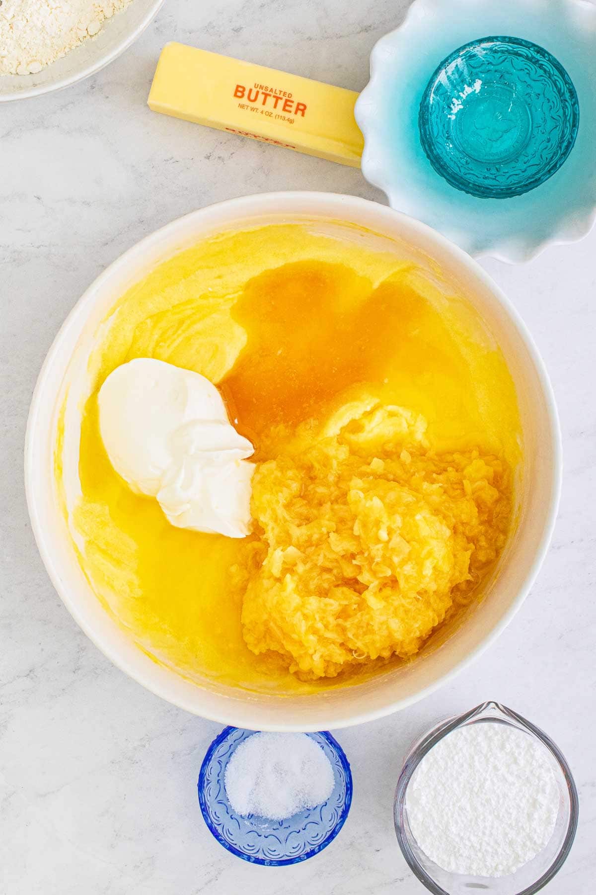 pineapple bread batter in a white bowl