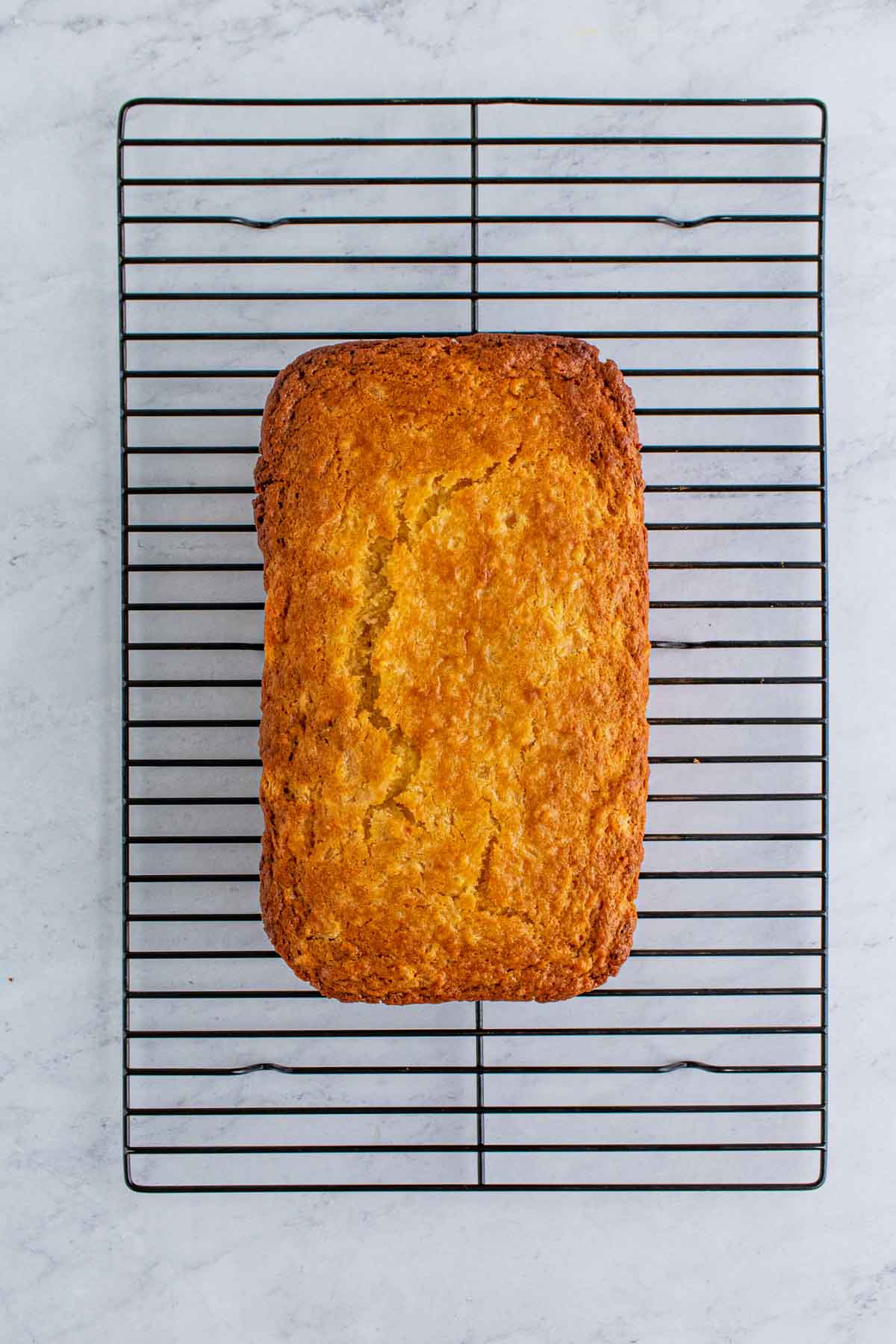 pineapple bread cooling on a wire rack