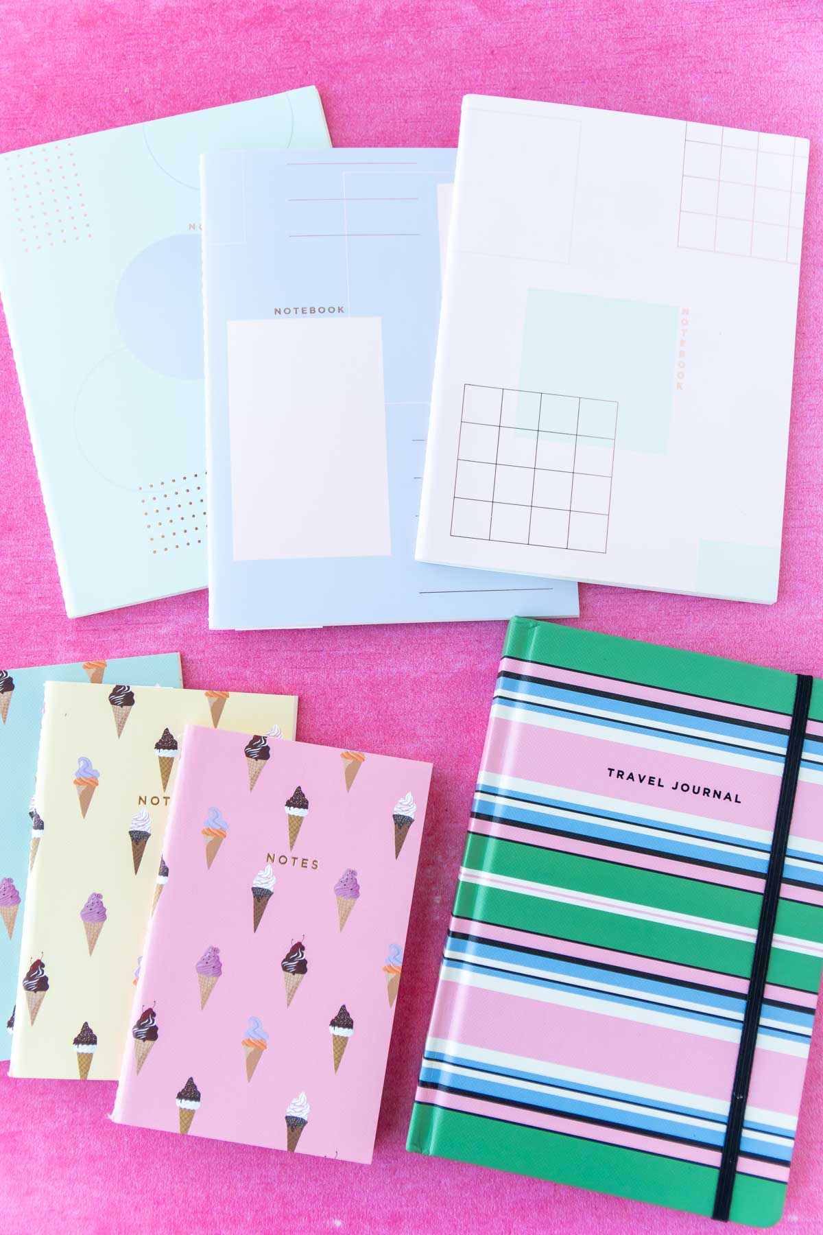 colorful notebooks and planners in a pile