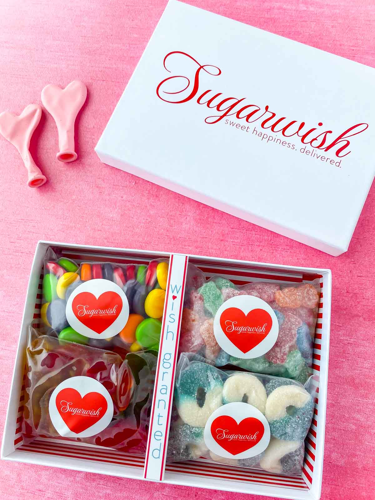 White Sugarwish box with four types of candy in it