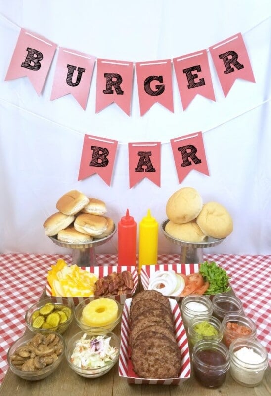 burger bar setup with all the toppings