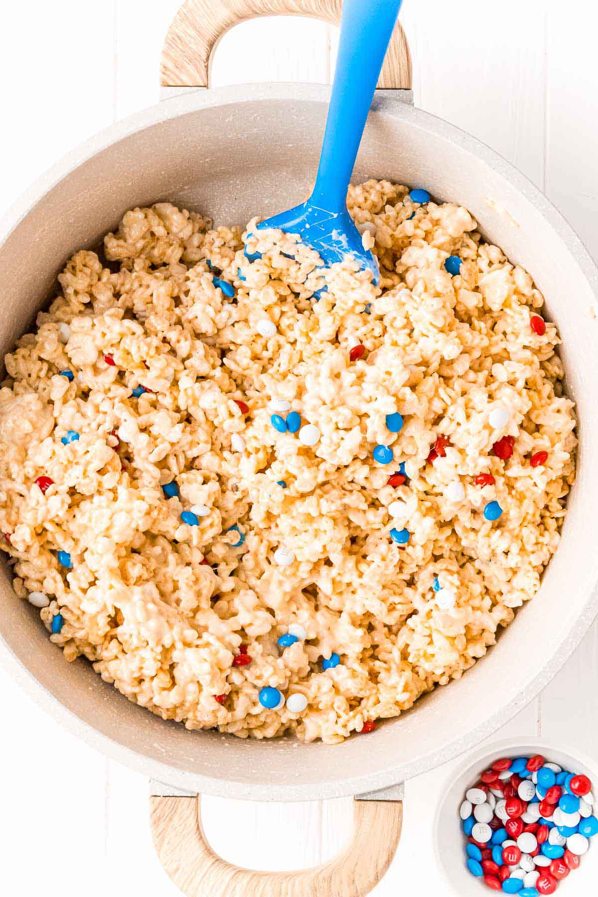 white pot with rice krispies with M&Ms