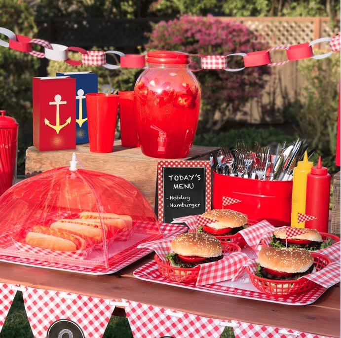 Table with hamburgers and hot dogs