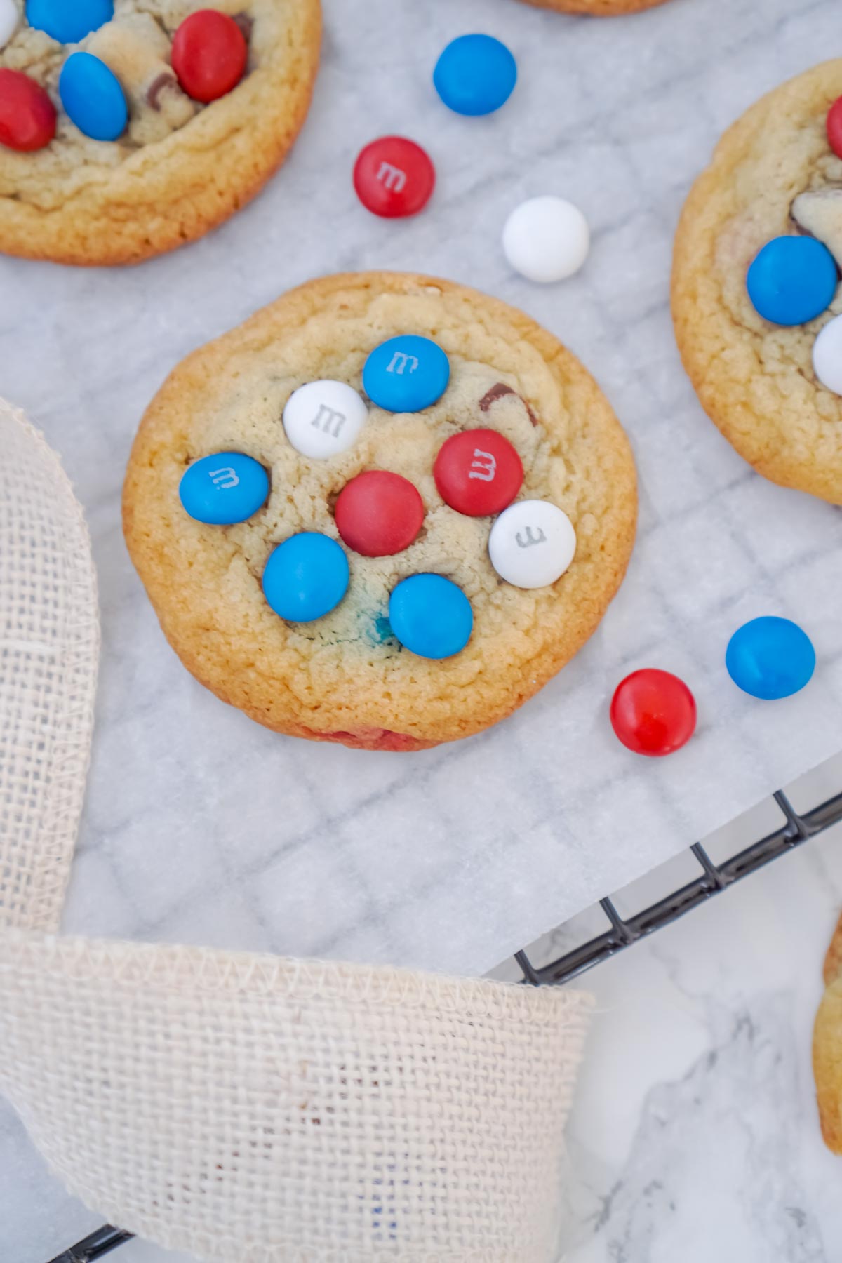 chocolate chip M&M cookies cooling on a wire rack