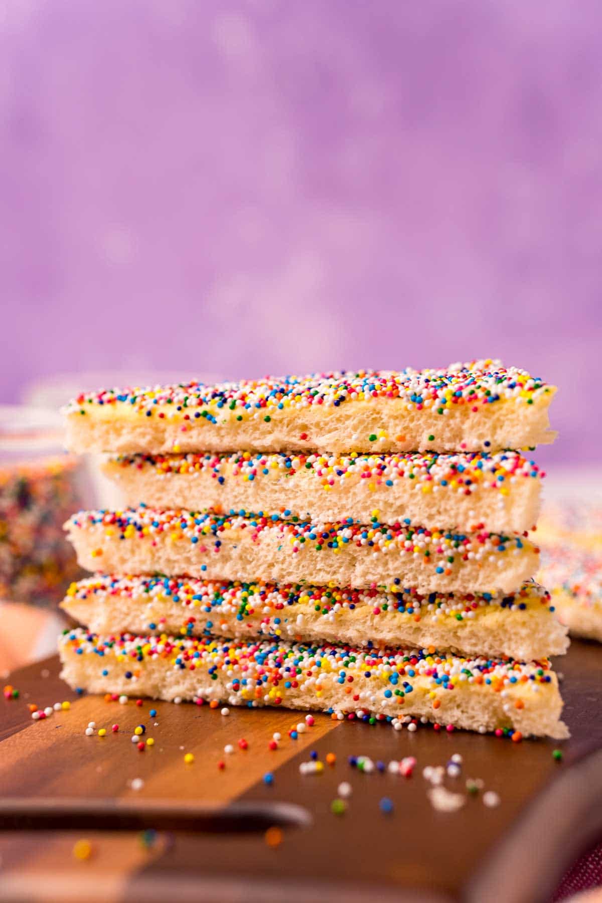 stack of fairy bread with a purple background