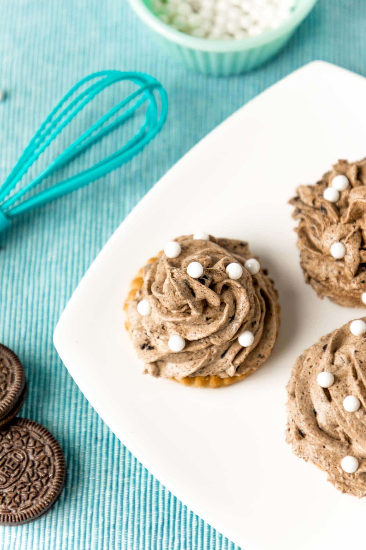 top down view of a grey stuff cookie on a white plate