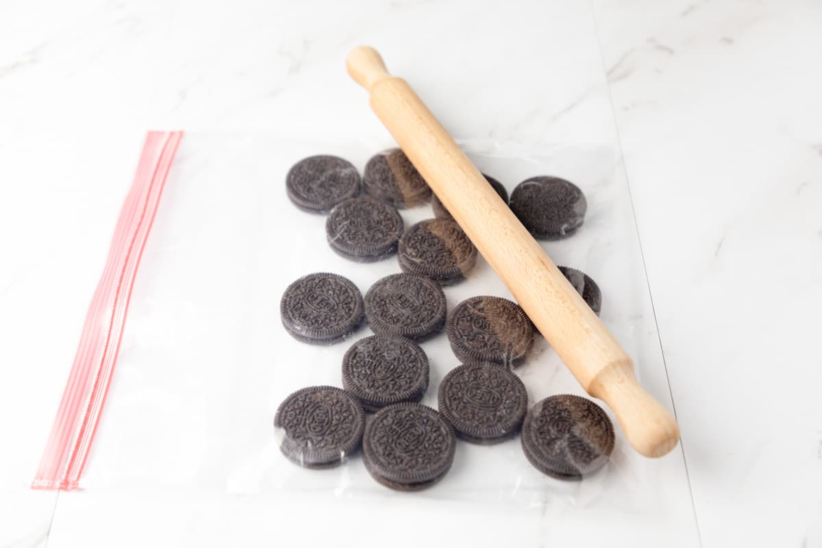 rolling pin on top of a bag of oreos